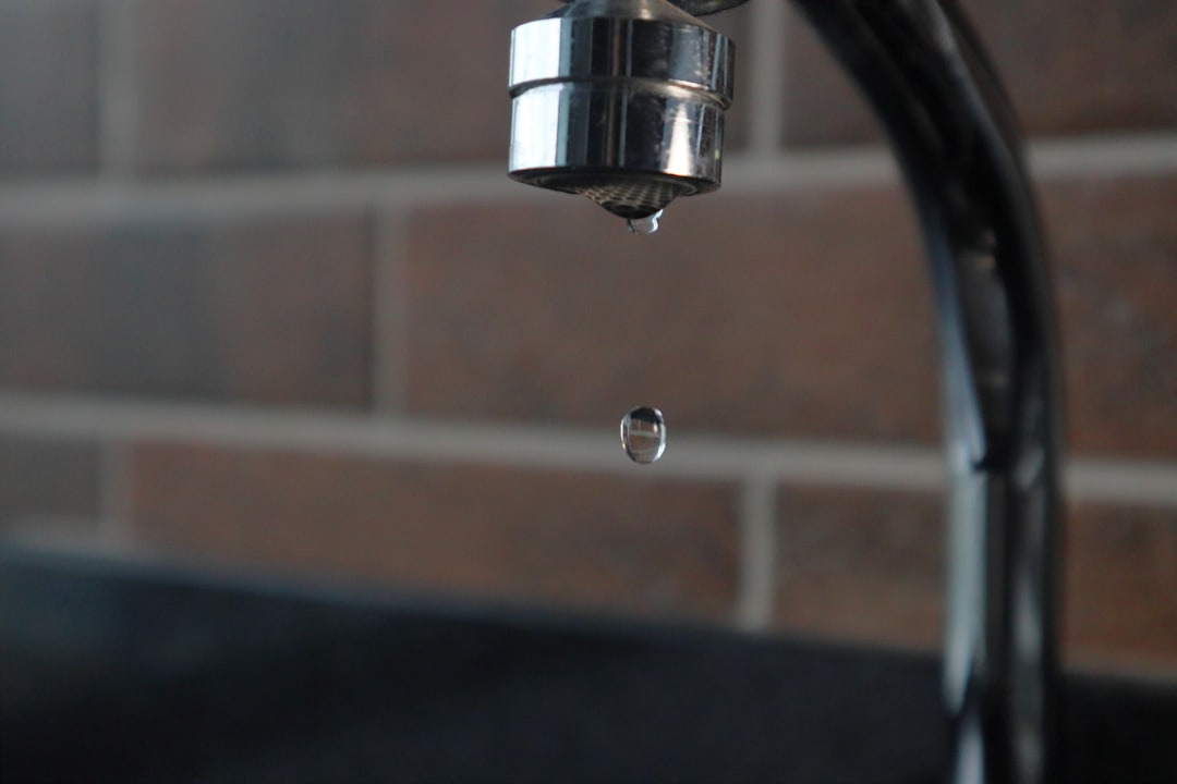 Picture of a faucet with water dripping from it