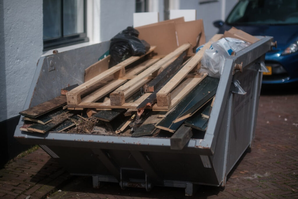Bin containing waste building materials
