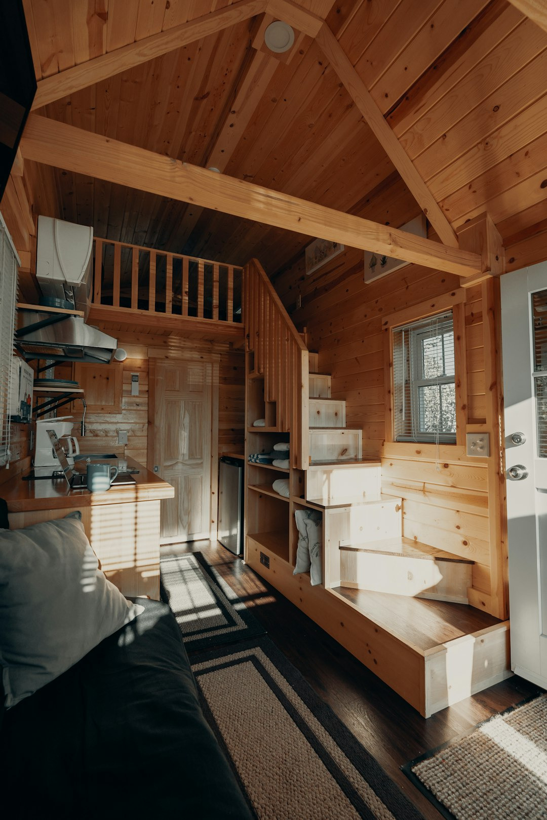 Picture of the interior of a tiny house finished with wood