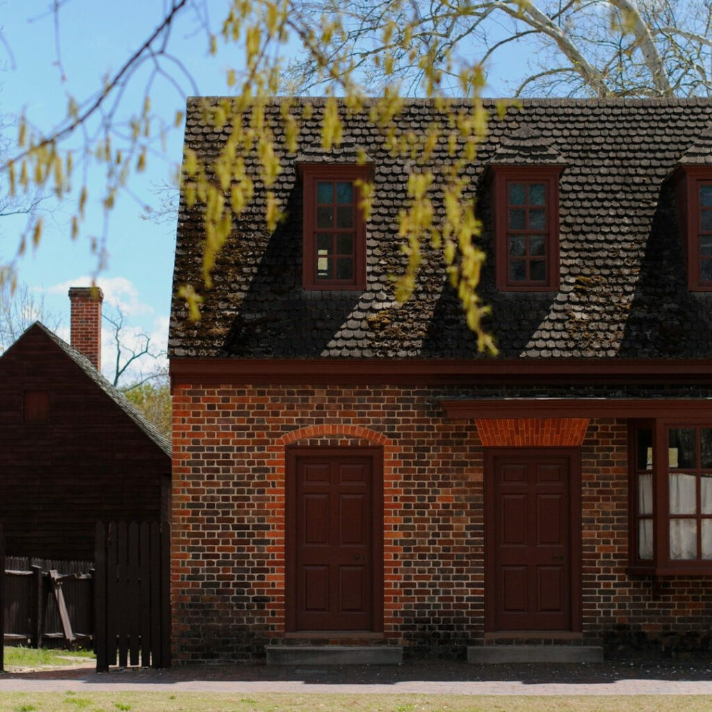 Picture of a brick house in a colonial setting