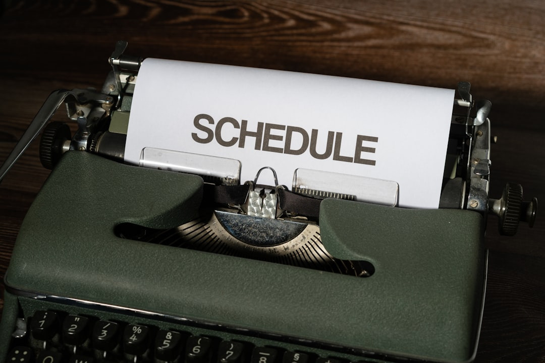 Picture of typewriter with page reading "Schedule"